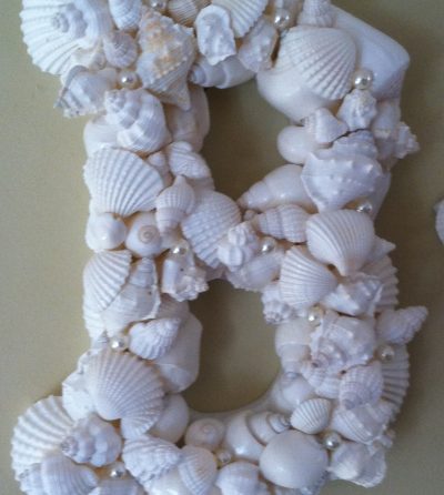 White Shells on Wooden Letter